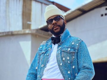 Ebuka Obi-Uchendu wearing a crystal-covered denim jacket and pink trousers at Big Brother Naija Season 10 premiere