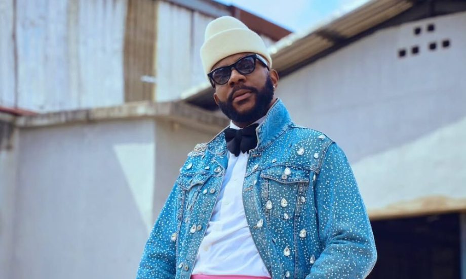 Ebuka Obi-Uchendu wearing a crystal-covered denim jacket and pink trousers at Big Brother Naija Season 10 premiere