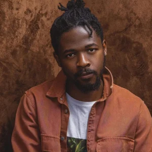 Johnny Drille performing passionately